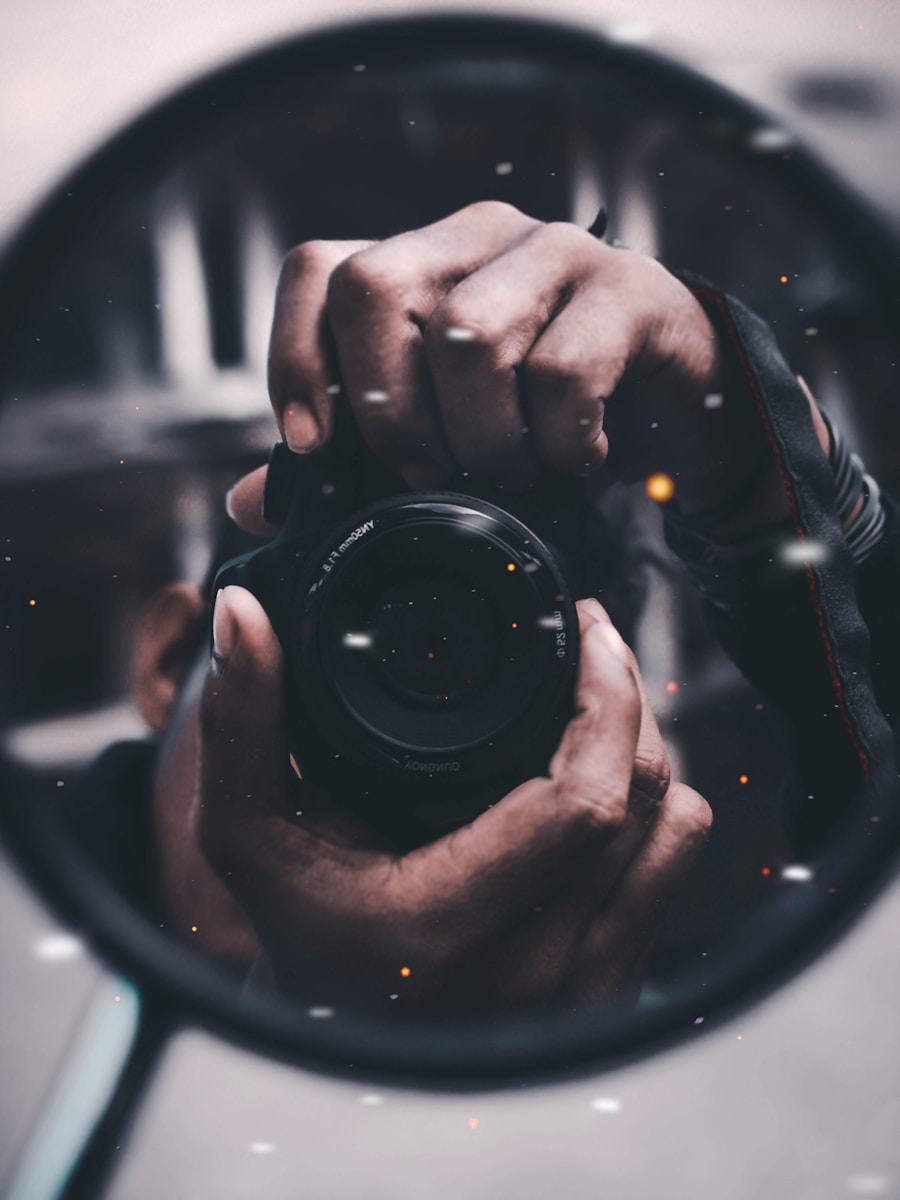 person holding black DSLR camera